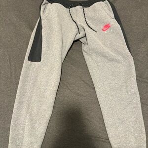 Nike Gray Sweatpants with Black Panels and Red Swoosh
